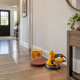 Paint-ready smooth wall in a contemporary entry hall with an inactive compatible sander and Ingco sanding discs nearby