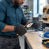 African American maintenance technician bending a small wire with Ingco 6-inch combination pliers at an organised service bench.