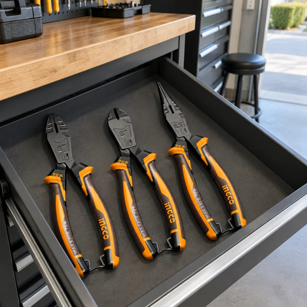 Ingco three-piece compound-action pliers set stored in an organized residential garage tool drawer.