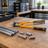 Prepared compatible metal stock arranged beside an Ingco HBC0814 bolt cutter in an orderly maintenance area.