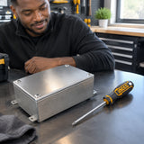 Completed bench repair with a closed metal access cover and Ingco PH1 screwdriver nearby