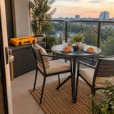 Completed metal bistro table on an apartment balcony with the closed Ingco HKTHP51498 tool set nearby.
