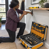 African American homeowner using an Ingco HKTHP52288 screwdriver to fit an entryway shelf bracket beside the open tool case