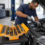 African American mechanic using an Ingco HTCS261168 ratchet on a vehicle fastener beside the open tool chest