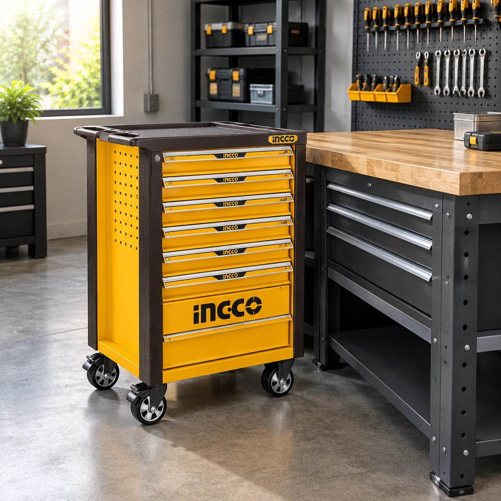 Closed Ingco HTCS273561 rolling tool chest parked beside a workbench in an organised workshop