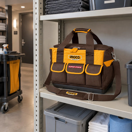 Closed Ingco HTBG12 tool bag resting on a storage shelf in an organized hotel maintenance alcove