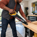 African American homeowner using an Ingco 400mm SK5 hand saw to cut a supported timber shelf board