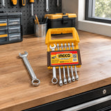Ingco metric combination spanner set resting on an organised home workshop bench beside its tool drawer