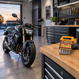 Serviced motorcycle ready for use beside the closed Ingco HKSPAR2062 ratchet spanner set in a tidy workshop