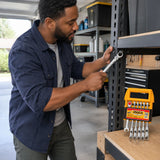 African American homeowner using an Ingco flexible ratchet spanner to tighten an angled fastener on steel garage shelving.