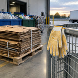 Sorted cardboard ready for collection with Ingco HGVK65 PVC-dot gloves resting on a recycling cage