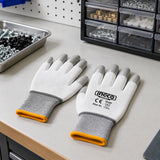 Ingco HGPUG62 precision gloves resting on an organised small-parts assembly workstation