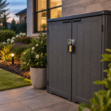 Locked Ingco padlock securing an organised outdoor garden storage cabinet at blue hour