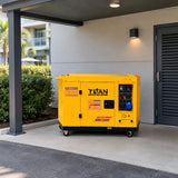 Titan yellow silent diesel generator parked on a concrete pad in a covered hospitality service yard