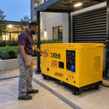 Facilities coordinator checking the Titan 8.5kW diesel generator control panel in a hospitality service courtyard