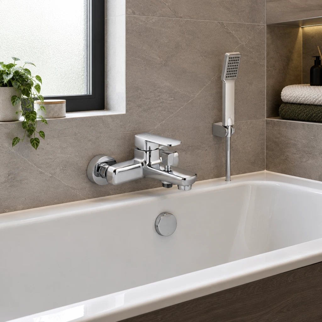 Vado chrome bath shower mixer and handheld shower installed beside a contemporary bathtub
