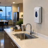 Clean office lunchroom wash station with a wall-mounted automatic soap dispenser ready for the next users