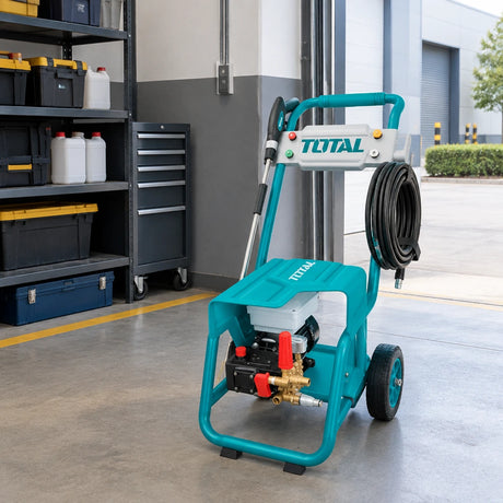 Total TGT11176 commercial pressure washer parked in an organised facilities-maintenance service bay