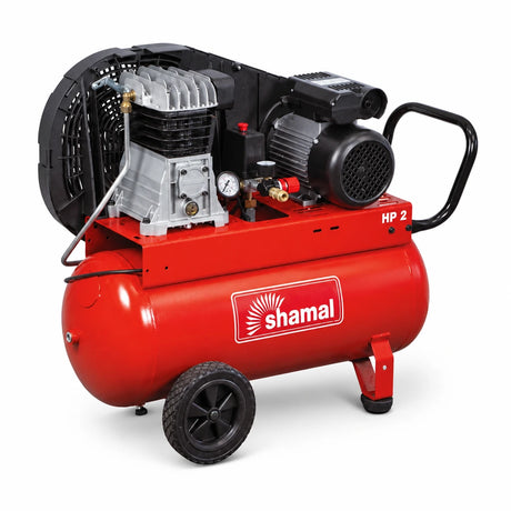 Shamal SB28/100 red 100-litre electric air compressor with exposed pump, motor, gauge and wheels on a white background
