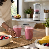 Finished fruit smoothies served at a breakfast nook with the Philips HR2058 blender visible nearby