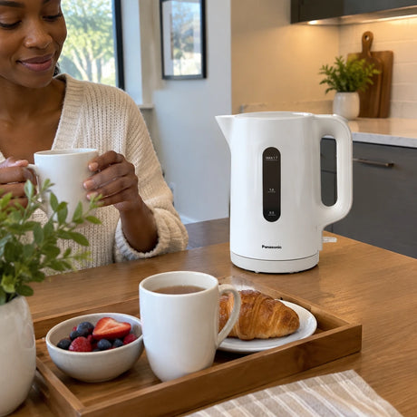 Panasonic K101 white electric kettle beside freshly prepared hot drinks at a contemporary breakfast nook