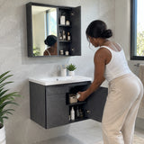 African American adult organising toiletries inside the cabinet of a wall-mounted 60cm bathroom vanity