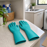 Turquoise Total PVC work gloves resting on a utility room shelf ready for cleaning or gardening
