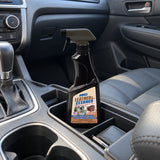 Abro LC-472 leather and vinyl cleaner bottle resting in a vehicle center console before interior cleaning