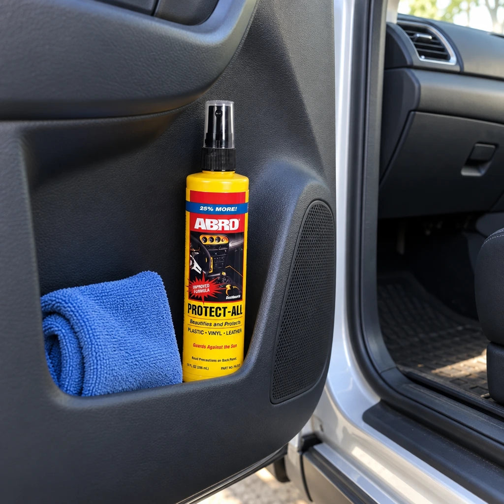 Abro dashboard cleaner bottle stored upright in a car door pocket before interior cleaning