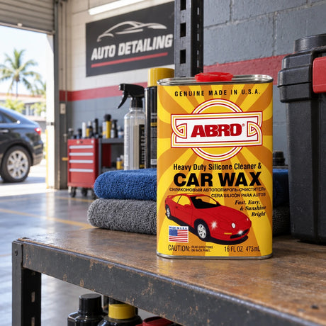 Closed Abro SW-300 car wax tin resting on a shelf in a Ghanaian auto detailing garage