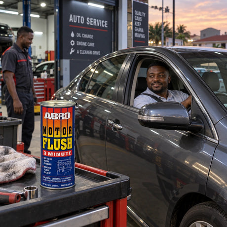 Vehicle owner beside a serviced car with an Abro MF-390 Motor Flush can on a garage service cart