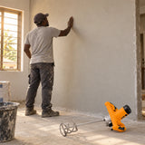 Freshly plastered home wall inspected beside a resting Coofix electric mortar mixer