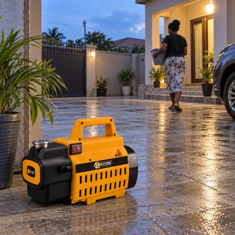 Clean residential courtyard with a Coofix pressure washer resting in the foreground