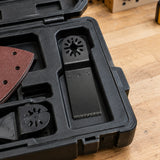 Coofix oscillating saw blade resting in an organised workshop tool-storage compartment