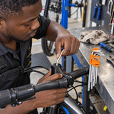 Ghanaian bicycle technician using a Coofix ball-end hex key on a recessed stem fastener