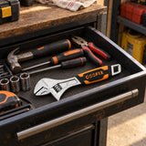 Coofix 6-inch adjustable wrench resting in an open workshop tool drawer