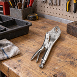 Coofix curved-jaw locking pliers resting on a wooden workshop bench before use