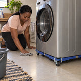 Homeowner cleaning the accessible floor beside a washing machine supported on a Coofix adjustable wheeled base stand