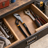 Coofix 12-inch pump pliers resting in an organized workshop tool drawer before plumbing work
