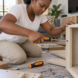 Ghanaian adult tightening a cabinet screw with a Coofix PZ2 Pozidriv screwdriver