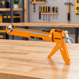 Solid-frame Coofix caulking gun on a workshop table