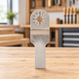 Tapered narrow silver blade on a workshop table