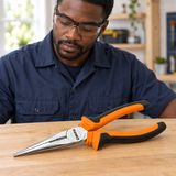 Technician assessing Coofix 8-inch long-nose pliers on a workbench