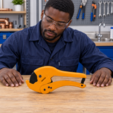 Technician assessing the Coofix pipe cutter on a workbench