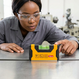 Technician checking a steel work surface with the Ingco magnetic hand level