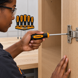 Technician fastening a cabinet hinge with one Coofix screwdriver