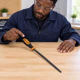 Technician inspecting the Coofix hand file on a workbench