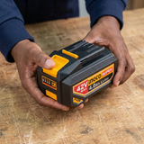 Technician inspecting the Ingco 4.0Ah battery