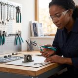 Technician inspecting the JcTop straight-tip circlip pliers at a workshop bench