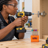 Technician using a Coofix screwdriver bit to fasten a cabinet hinge